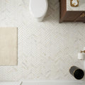 Calacatta Gold (Italian) Marble 1x4 Honed Herringbone Mosaic — Powder Room floor