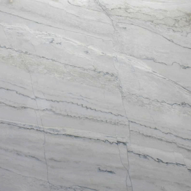 Close-up of Calacatta Lux leathered quartzite with a light gray surface and fine flowing veins.