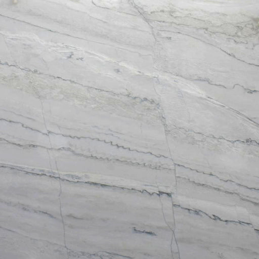 Close-up of Calacatta Lux leathered quartzite with a light gray surface and fine flowing veins.