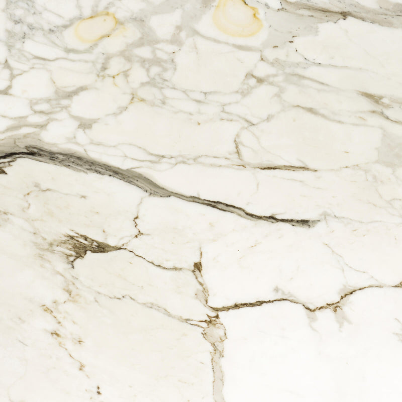Calacatta Oro Borghini marble slab surface with an ivory-white base and gray, brown and gold veining.