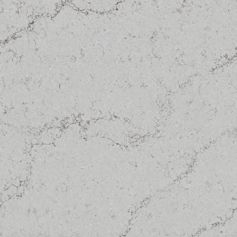 Calacatta Vesuvio slab with a pearl-white background, delicate gray-taupe veins and subtle mineral flecks.