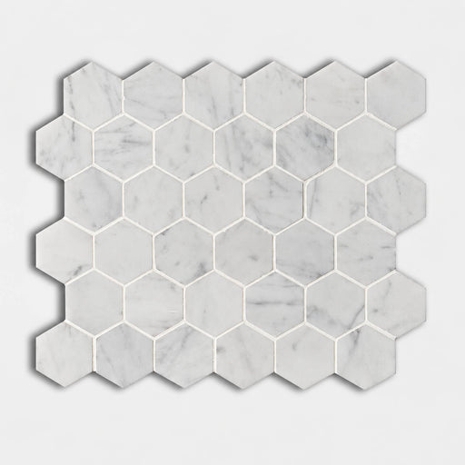 Carrara White 2-inch honed marble hexagon mosaic with soft gray veining on an approximately 12x12-inch sheet.