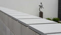 Close-up of Bayside Ocean Slate Natural 21 x 21 x 2 Slate Column Cap Cap, in Bayside Ocean tones.