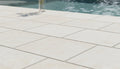 Close-up of Desert Sand Limestone Tumbled 24 x 24 x 2 4-SIDED Modern Coping, in Desert Sand tones.