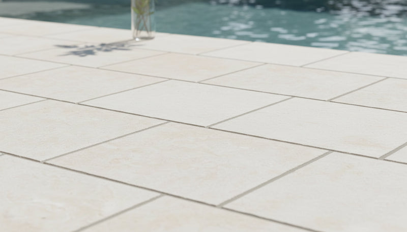 Close-up of Desert Sand Limestone Tumbled 24 x 24 x 2 4-SIDED Modern Coping, in Desert Sand tones.