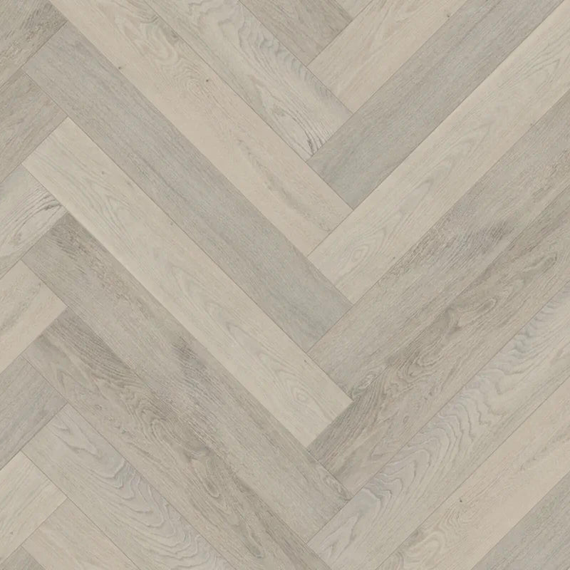 Celeste Herringbone Chaumont 6x36 3mm European oak hardwood flooring in a light greige herringbone pattern.