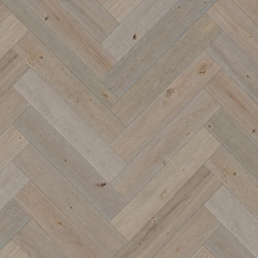 Pyrenees European oak hardwood flooring with light greige wood grain in a herringbone pattern.