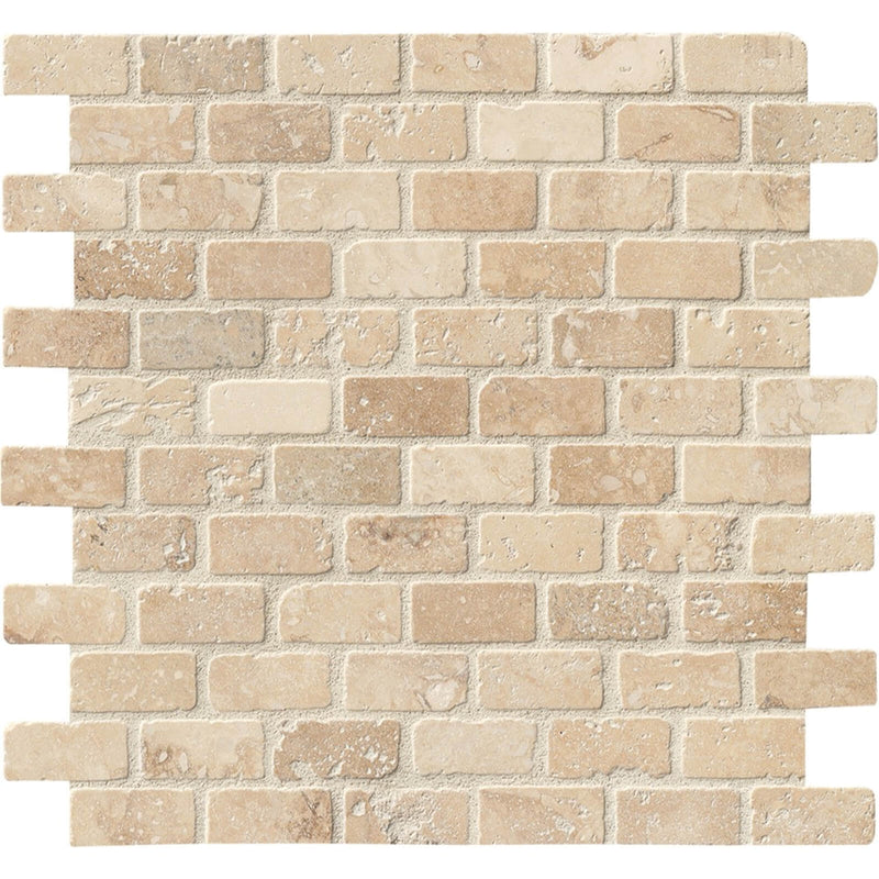 Chiaro Brick 1x2 tumbled travertine mosaic with warm beige pieces, natural pores and softly rounded edges in staggered rows.