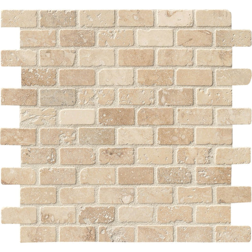 Chiaro Brick 1x2 tumbled travertine mosaic with warm beige pieces, natural pores and softly rounded edges in staggered rows.