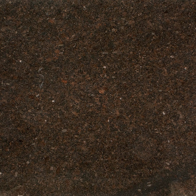 Close-up of Coffee Brown granite with dark brown, black and reddish mineral flecks.