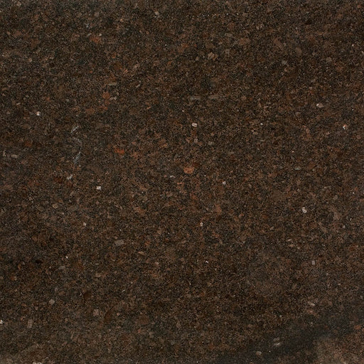 Close-up of Coffee Brown granite with dark brown, black and reddish mineral flecks.