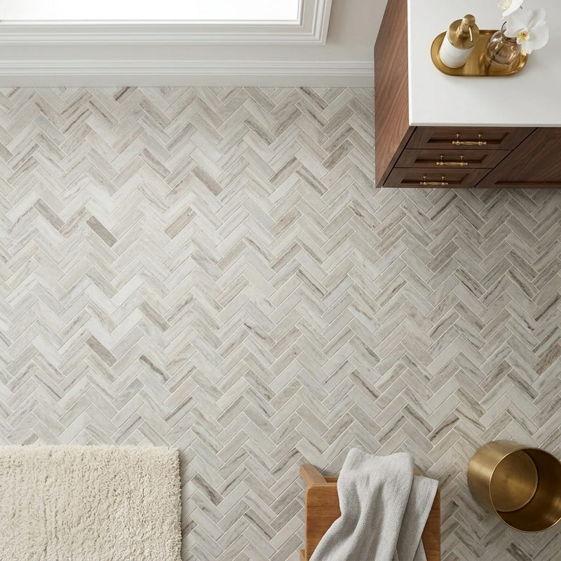 Completa Series Skyline 1x4 Honed Herringbone Marble Mosaic — Bathroom floor