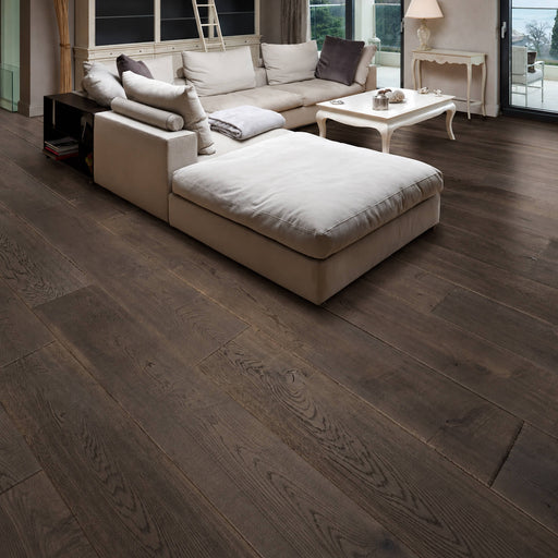 Composer Schumann engineered oak hardwood flooring with dark gray-brown wood grain in a living room.