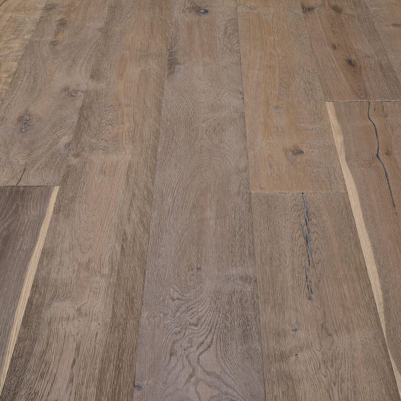 Composer Strauss European oak flooring with wide warm brown planks, visible knots and natural grain in an installed floor detail.