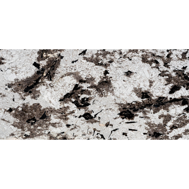 Copenhagen Extra polished granite with a pale crystalline background and dark brown and black mineral clusters.