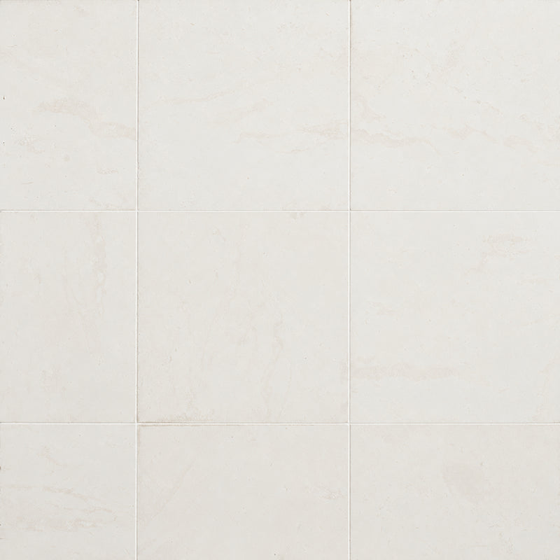 Corinthian White 24x24 filled and honed limestone tiles with soft ivory tones and subtle beige mineral patterns.