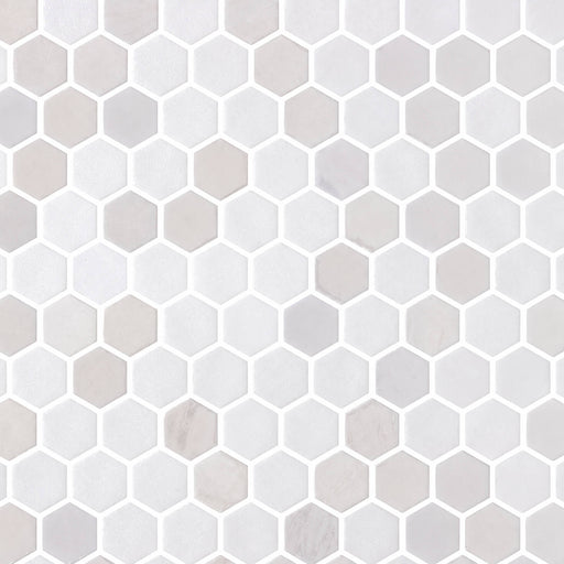 Cosmos Glass Blend Blanco 1.25-inch mesh-mounted hexagon mosaic with white and pale gray tiles.