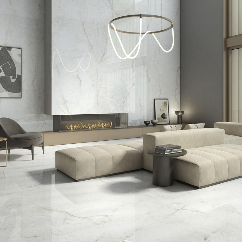 Crystal White 24x48 polished porcelain tiles on the floor and fireplace wall of a bright living room.