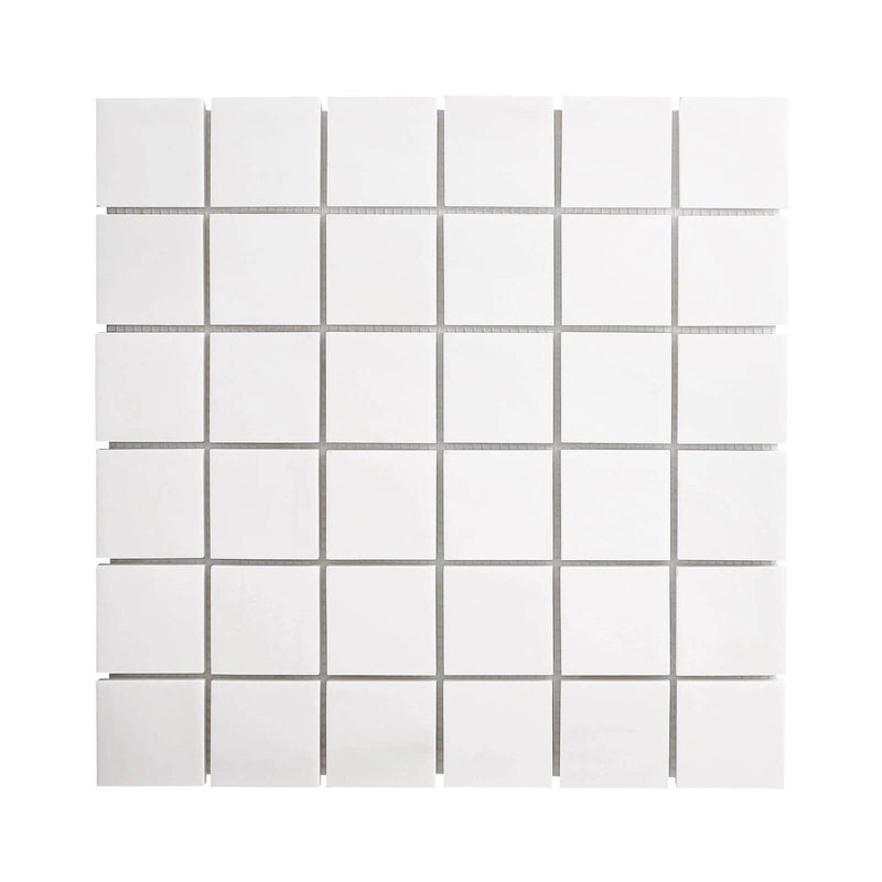 White Bianco Dolomite marble mosaic sheet with 2×2-inch square pieces and a matte honed finish.
