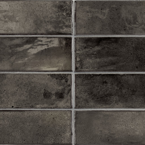 Equipe Hanoi Black Ash 2x6 ceramic tiles with a textured charcoal surface in a stacked layout.