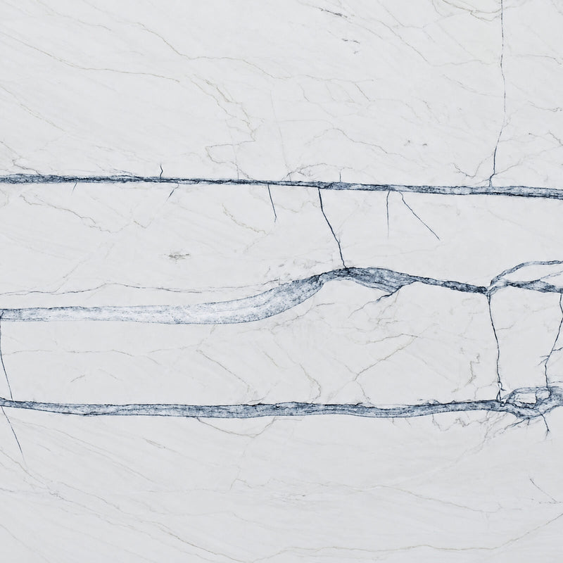 Fantasy Lux 2cm honed quartzite slab with an off-white background and flowing blue-gray veins.