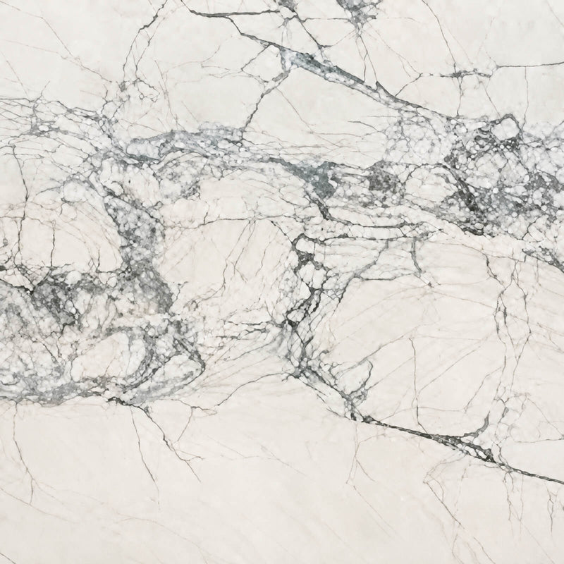 Fantasy Lux quartzite island surface close-up with branching gray veins and diagonal sunlight.
