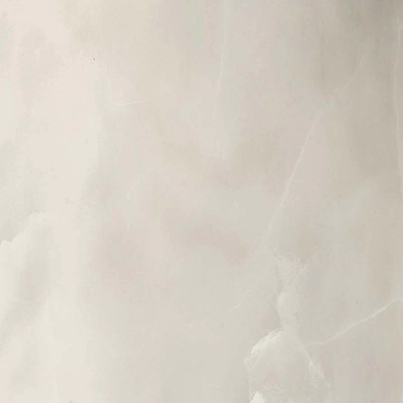 Florim Eccentric Luxe Cloudy White slab surface close-up with cloudy ivory tones and delicate white veins.
