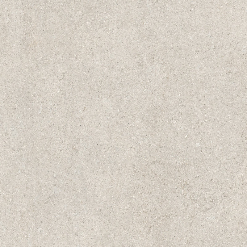 Florim Sensi White Fossil porcelain slab surface with a pale warm ivory background, subtle mineral flecks and softly mottled fossil patterns.