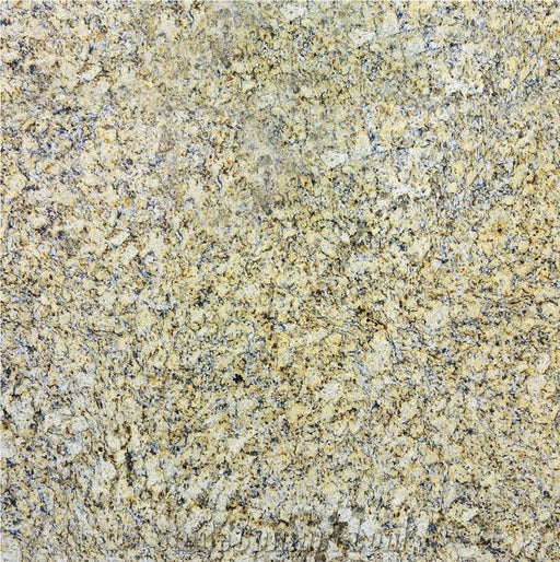Close-up of Giallo Napoli granite with cream and golden tones and dark mineral speckles.