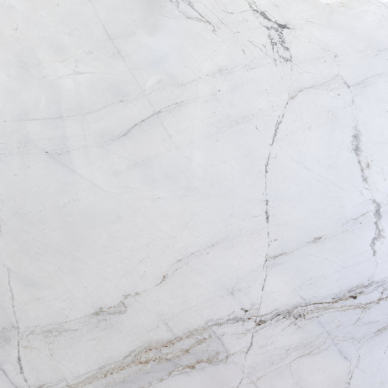 Glorious White 2cm honed marble slab with a soft white background, delicate gray veins and subtle beige mineral accents.