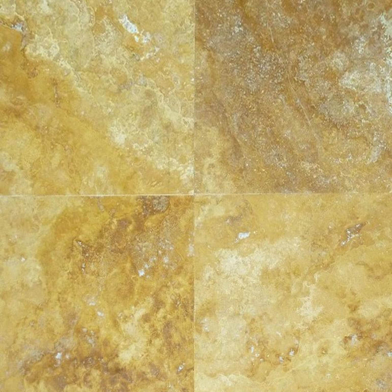 Four Golden Sienna filled honed travertine tiles with varied gold and cream tones.