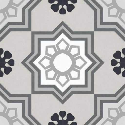 Gracia 7.9x7.9 matte ceramic tile with gray and white geometric patterns and black floral accents on a beige background.