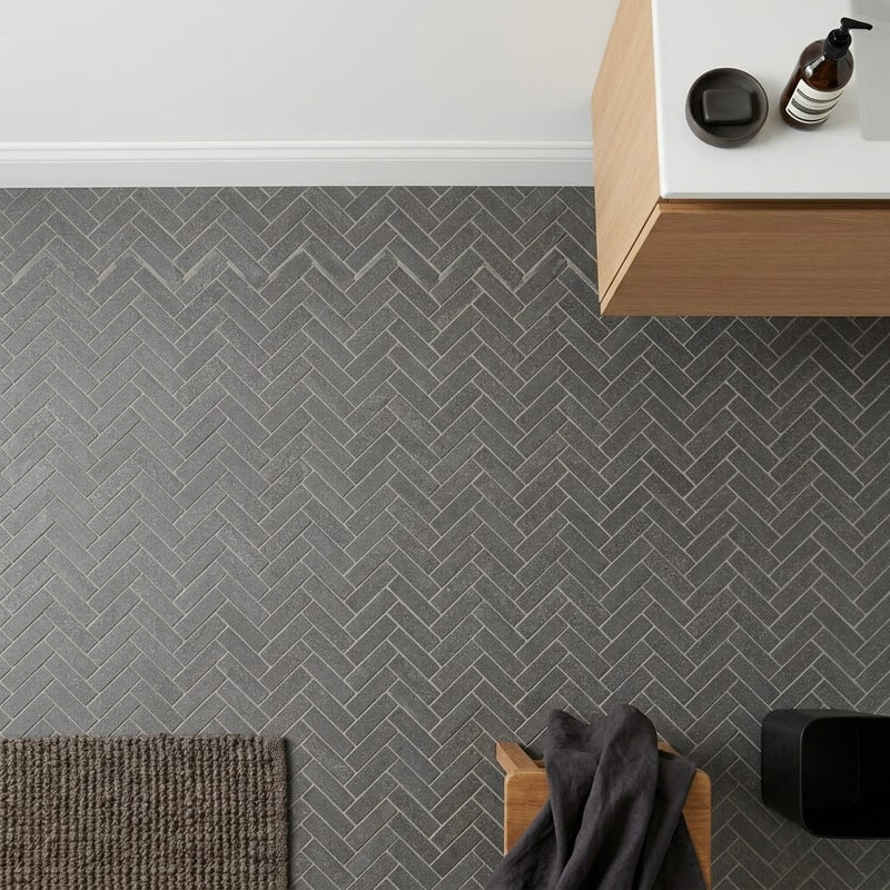 Herringbone 1x4 Honed Basalt Mesh Mosaic — Bathroom floor