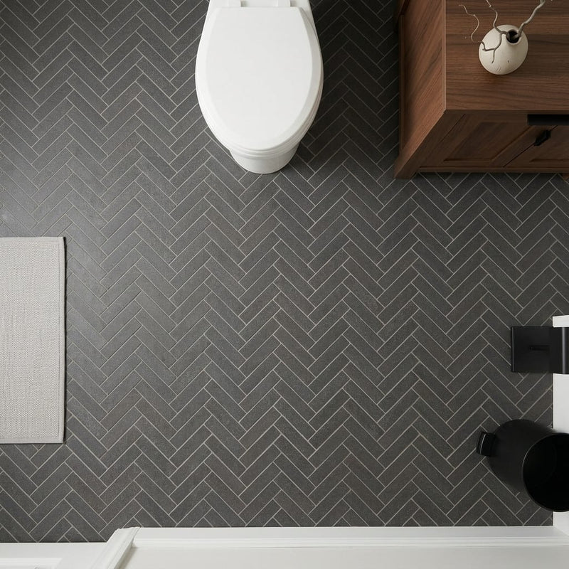 Herringbone 1x4 Honed Basalt Mesh Mosaic — Powder Room floor