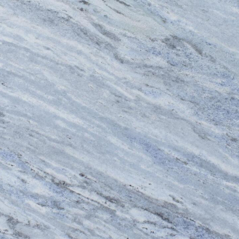 Iceberg Blue 2cm polished marble slab showing pale blue tones with diagonal white and gray veining.