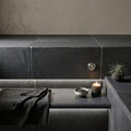 Indian Black Limestone Tumbled & Brushed 12 x 24 x 1.25 Bullnose Coping 12x24 pool coping — Spa spa overhang edge