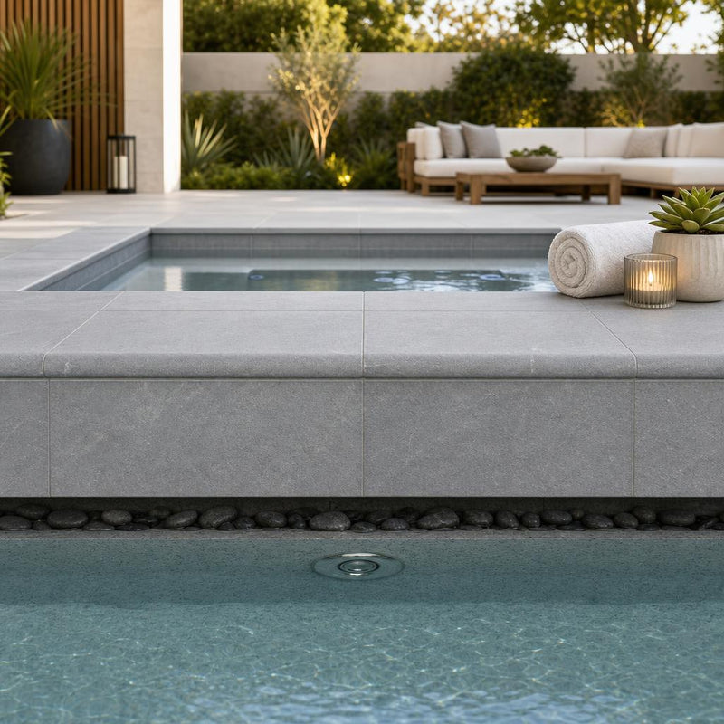 Indian Black Limestone Tumbled & Brushed 16 x 24 x 2 Bullnose Coping 16x24 pool coping — Spa spa overhang edge