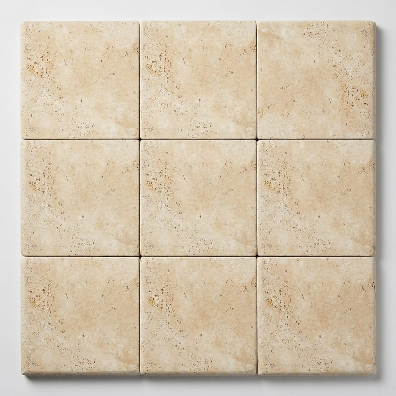 Ivory Beige Travertine Coping 12x12 Tumbled Bullnose 1.25 inch close-up