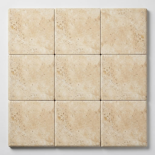 Ivory Beige Travertine Coping 12x12 Tumbled Bullnose 1.25 inch close-up
