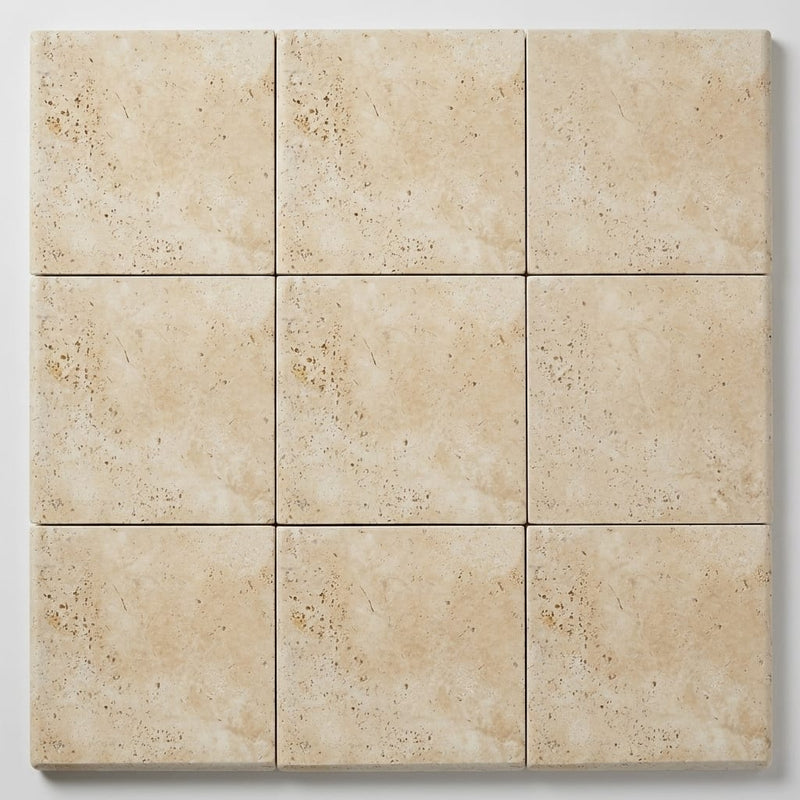 Ivory Beige Travertine Coping 12x12 Unfilled, Honed Bullnose 2 inch close-up