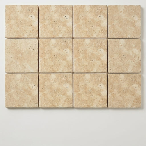 Ivory Beige Travertine Paver 6x6 Unfilled Chiseled 1.25 inch close-up