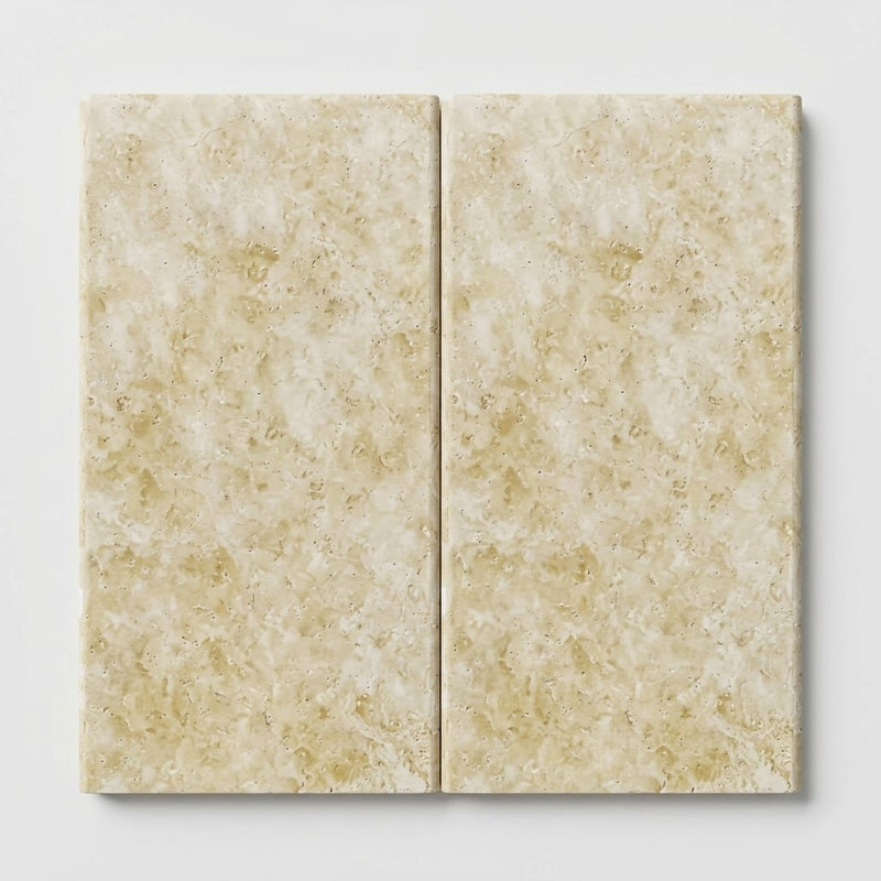 Ivory Cordoba Cream Travertine Tumbled 12 x 24 x 1.25 Double Bullnose Coping 12x24 close-up