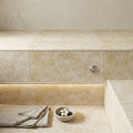 Ivory Cordoba Cream Travertine Tumbled 12 x 24 x 1.25 Double Bullnose Coping 12x24 pool coping — Spa spa overhang edge