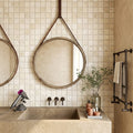 Ivory / Light Travertine 1x1 Cream Tumbled Mosaic — Bathroom shower wall