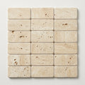 Ivory / Light Travertine 1x2 Cream Tumbled Herringbone Mosaic close-up