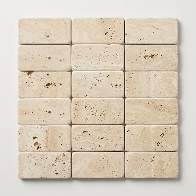 Ivory / Light Travertine 1x2 Cream Tumbled Herringbone Mosaic close-up