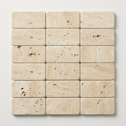 Ivory / Light Travertine 1x2 Cream Tumbled Herringbone Mosaic close-up