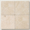 Ivory / Light Travertine 16x16 Cream Tumbled Tile close-up