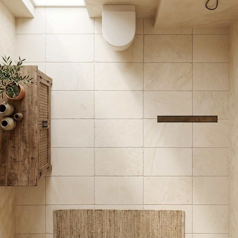 Ivory / Light Travertine 16x24 Cream Tumbled Tile — Bathroom floor