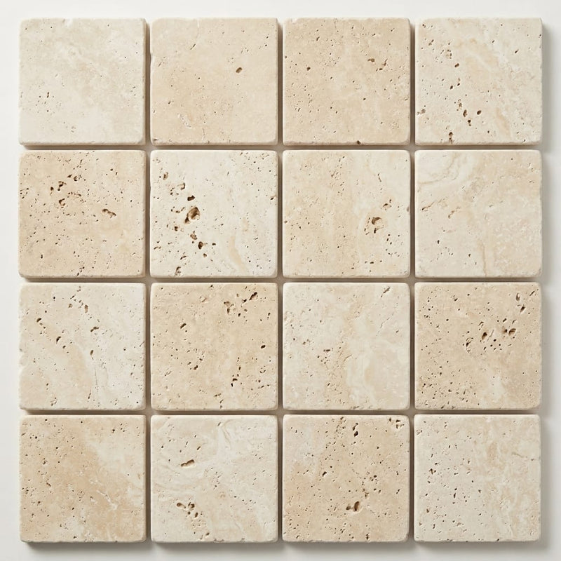 Ivory / Light Travertine 4x4 Cream Tumbled Tile close-up
